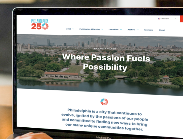 Laptop on desk showing Philadelphia 250 website